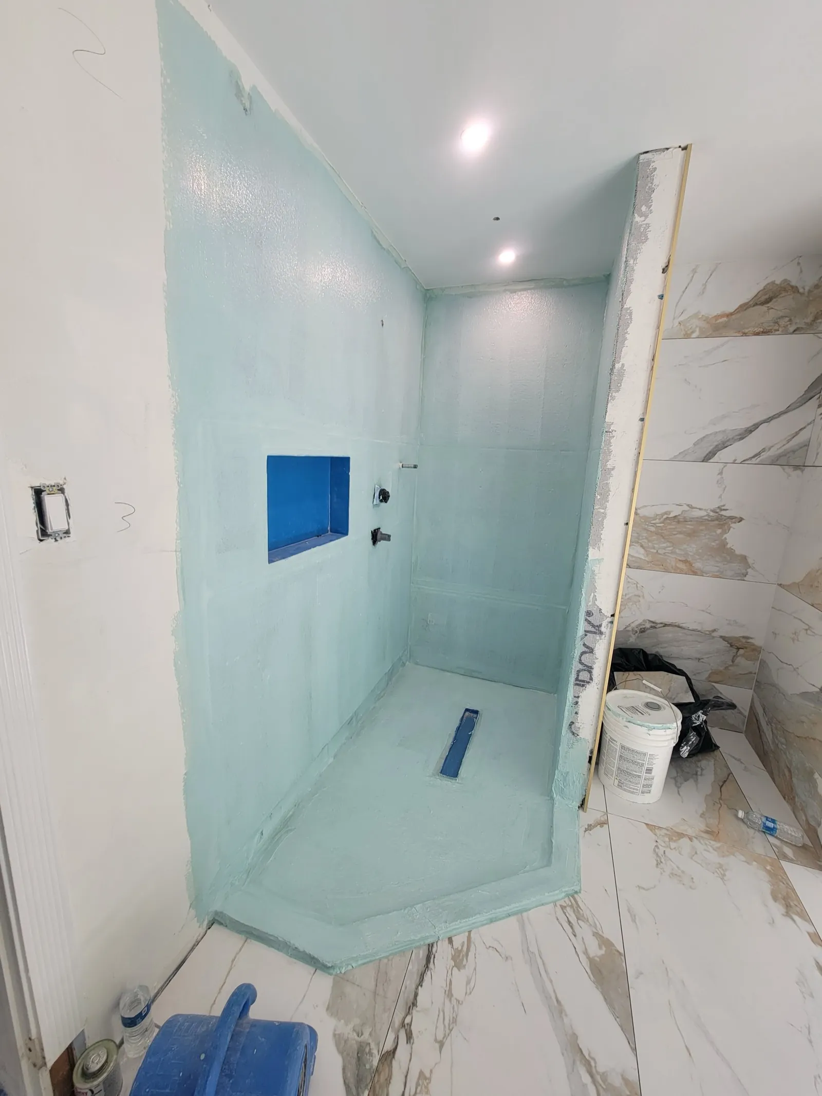 Shower waterproofing membrane installed before tile
