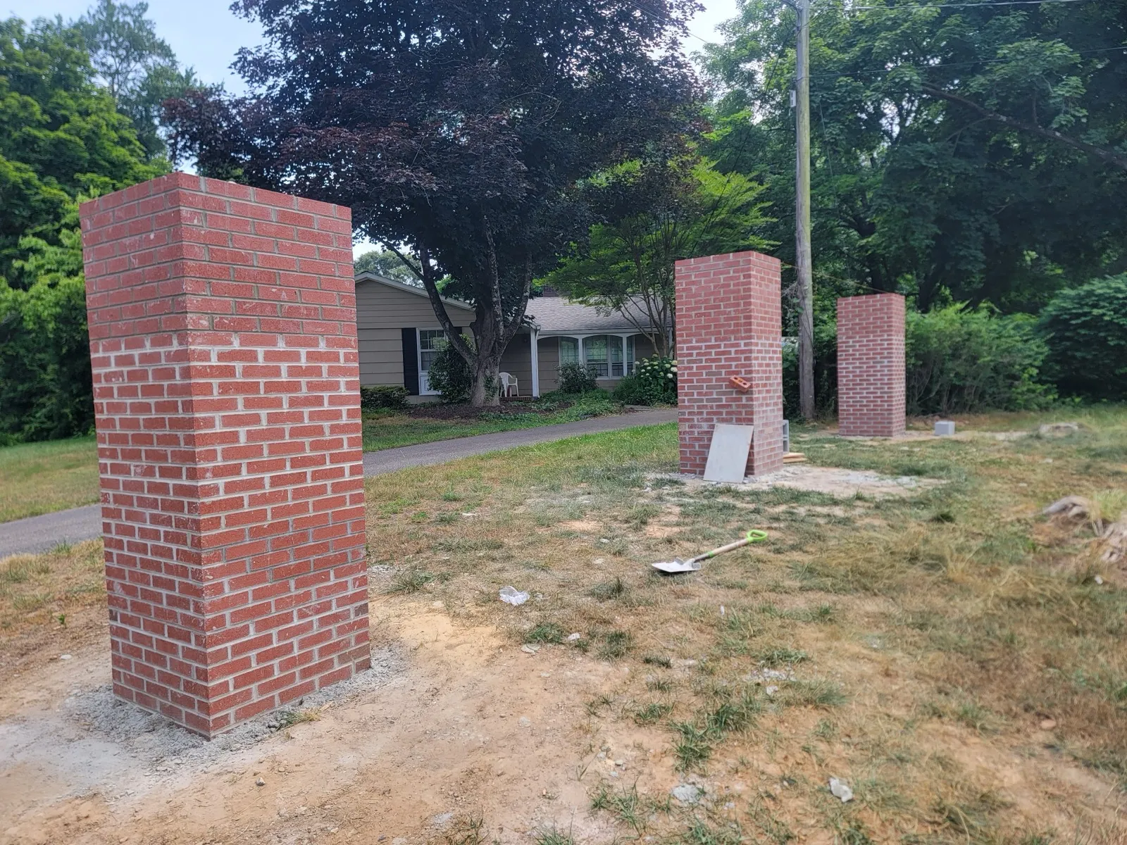 Brick mailbox columns built at a neighborhood entrance