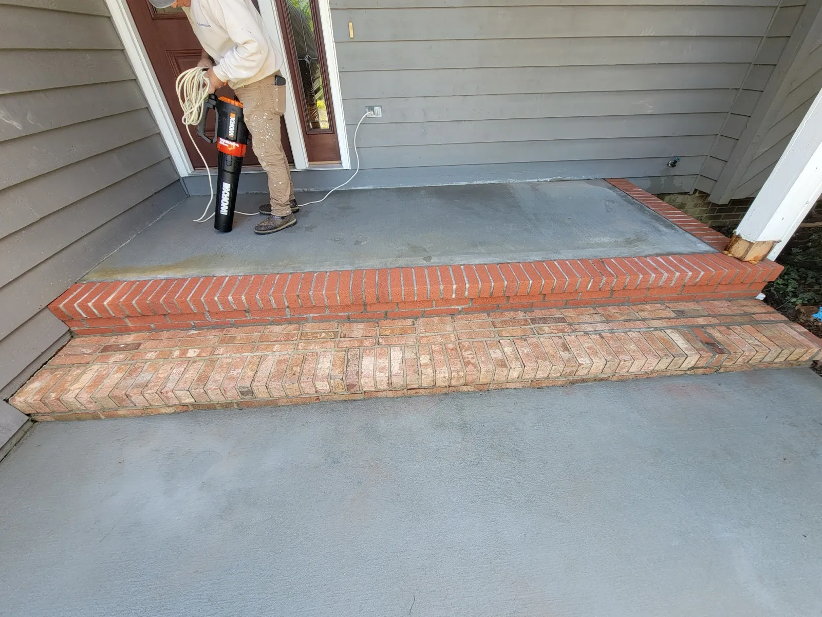 Concrete porch and brick steps resurfaced